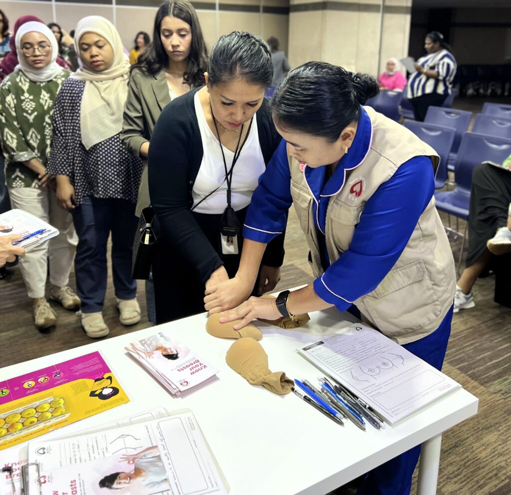 Breast health awareness and screening demonstration during International Women’s Day 2026 activities at QI Group