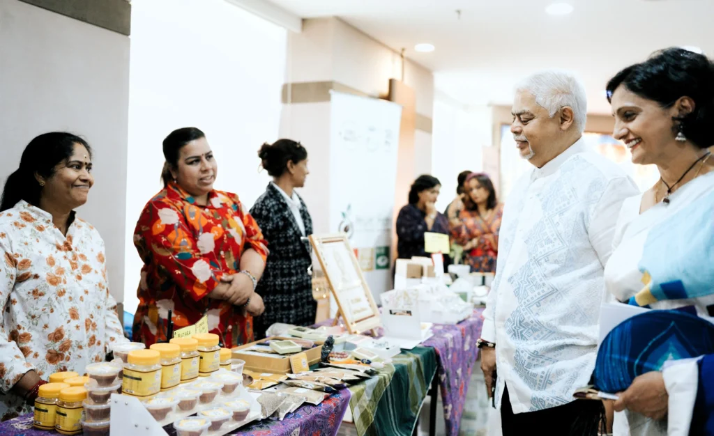 Dato’ Sri Vijay Eswaran and Datin Sri Umayal Eswaran engaging with vendors at a sustainable bazaar during International Women’s Day 2026
