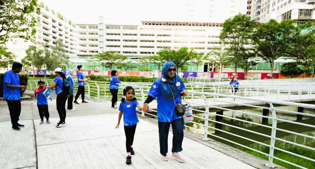 Participants take part in the Walk for Autism community walk in support of autism awareness and inclusion.