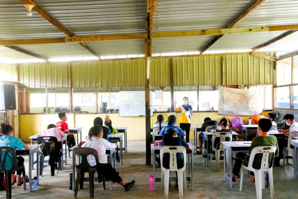 Students attend a classroom learning session as part of RYTHM Foundation’s Community Adoption Programme in Sabah.