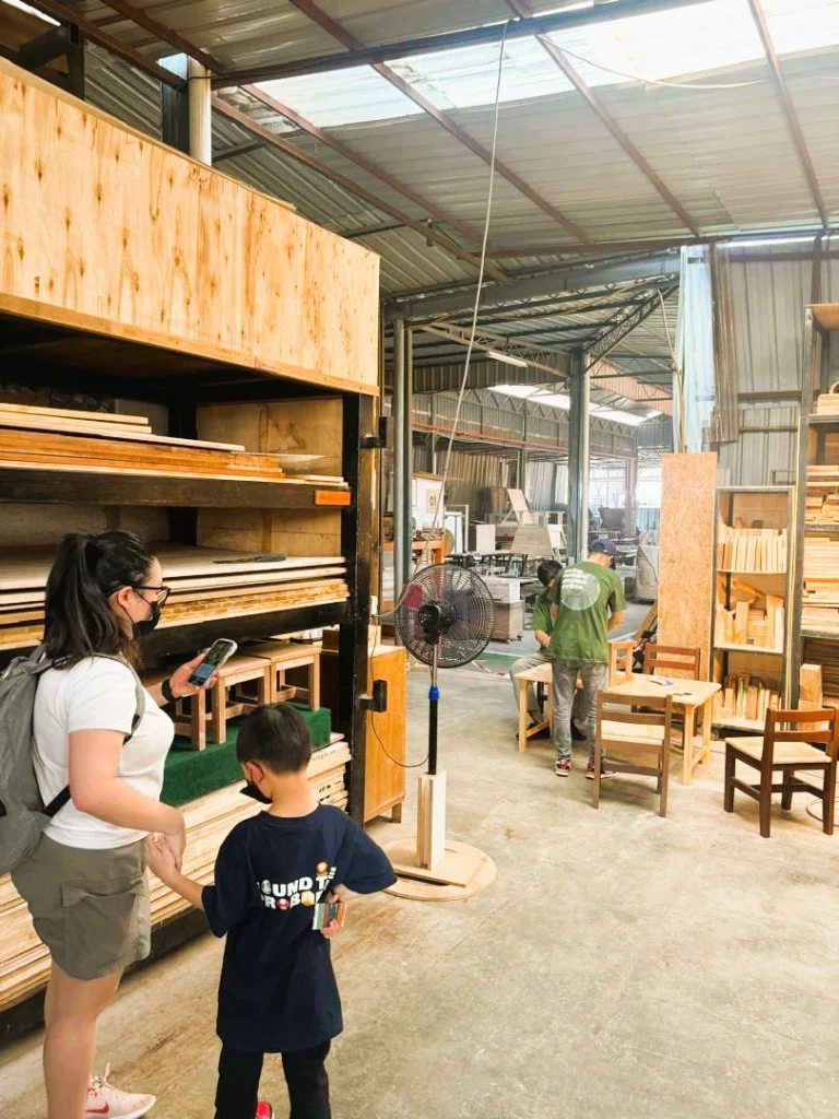 Visitors exploring The Green Factory during Merdekapenter 2026 and learning about sustainable woodworking practices